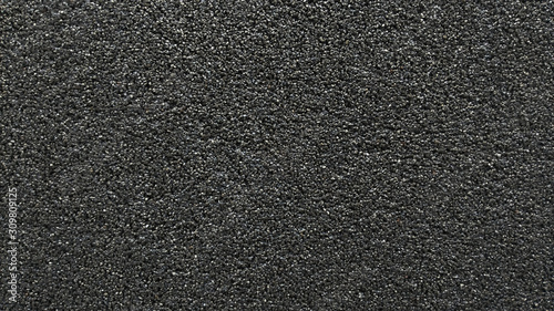 black texture consisting of many small grains. plaster