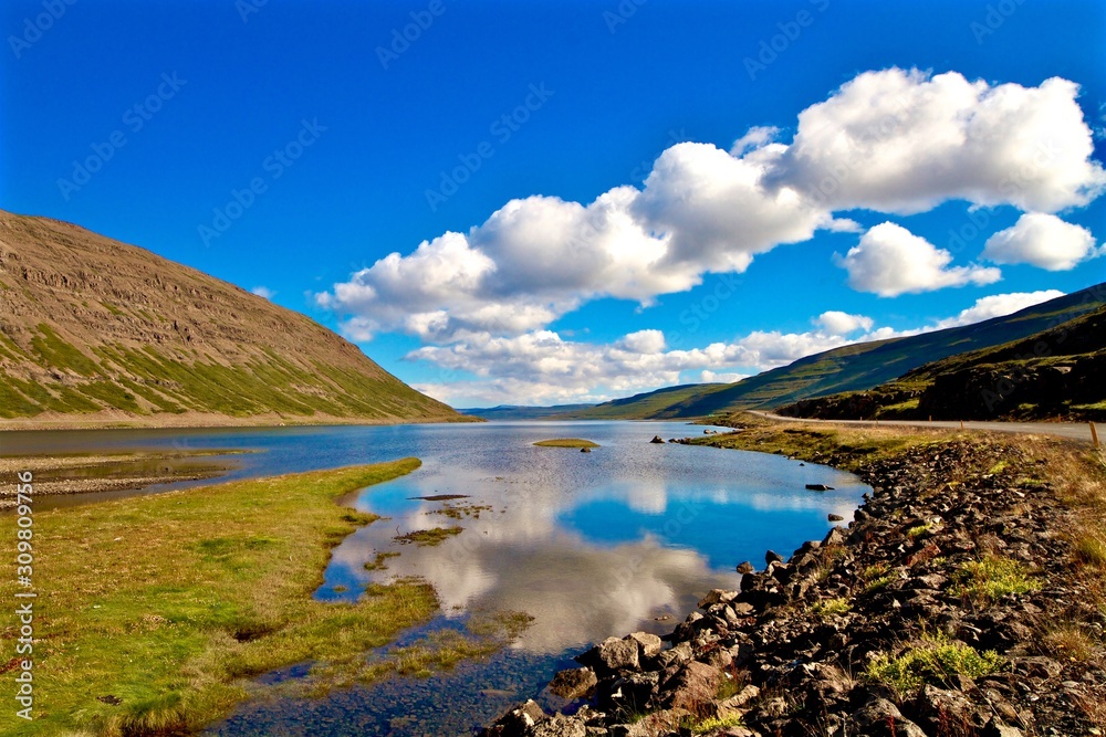 Clouds reflection in a mountain lake, Iceland Clouds reflection in a mountain lake, Iceland