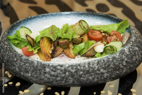 Salad with fried potato let...