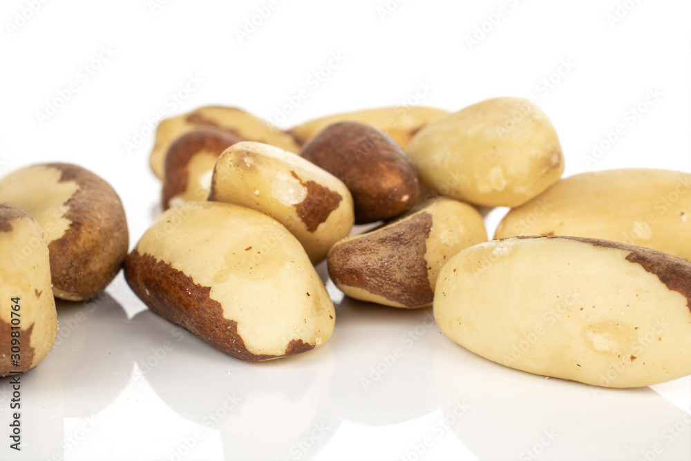 Lot of whole brazil brown nut stack isolated on white background Lot of whole brazil brown nut stack isolated on white background