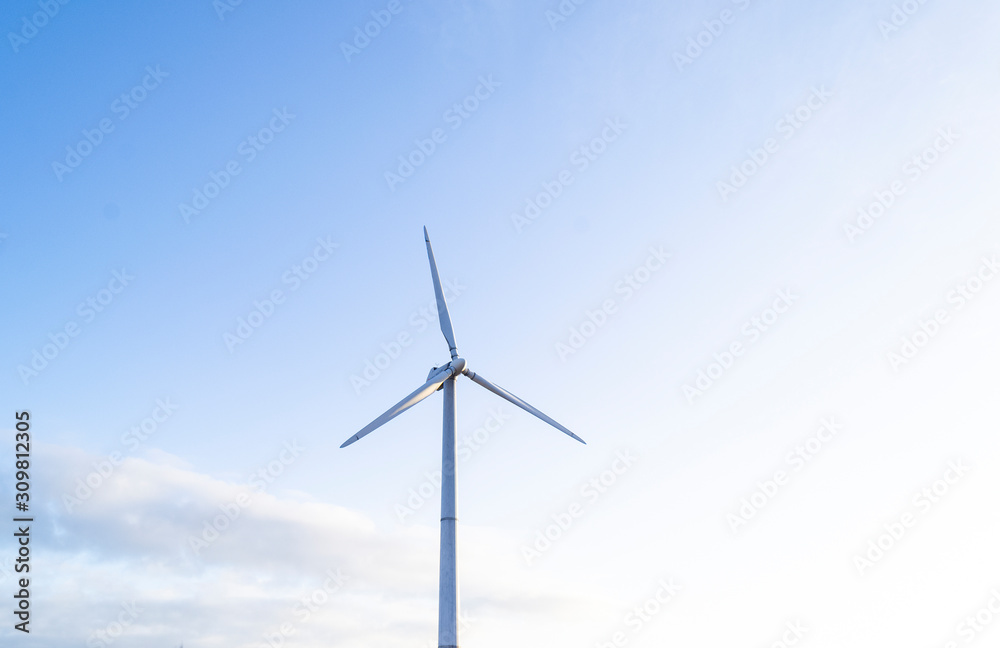 solar panels with wind turbines, selective focus, blur background
