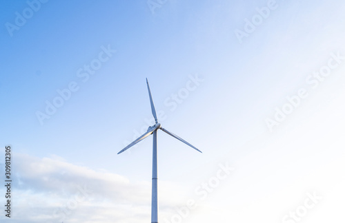 solar panels with wind turbines, selective focus, blur background