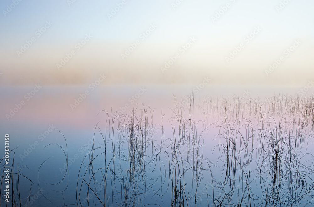 Autumn landscape at dawn of Moccasin Lake in fog, Michigan's Upper Peninsula, USA Autumn landscape at dawn of Moccasin Lake in fog, Michigan's Upper Peninsula, USA