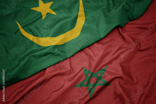 waving colorful flag of morocco and national flag of mauritania.