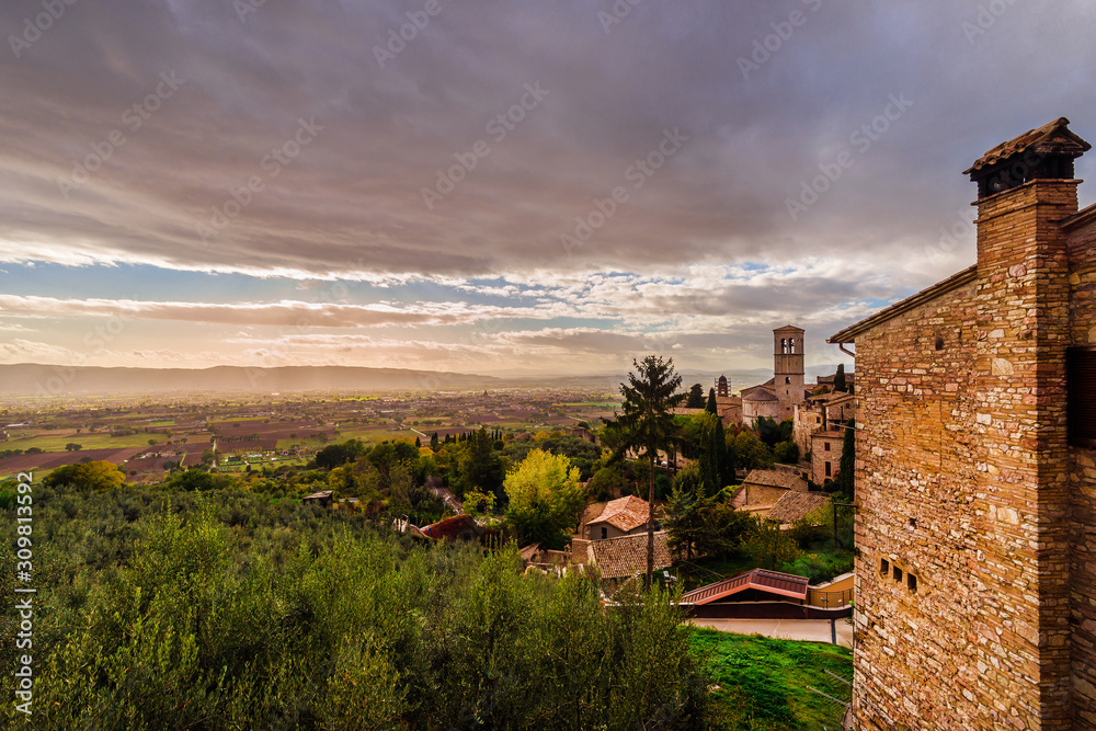 View of Umbria valley just before sunset from Assisi charming historic center