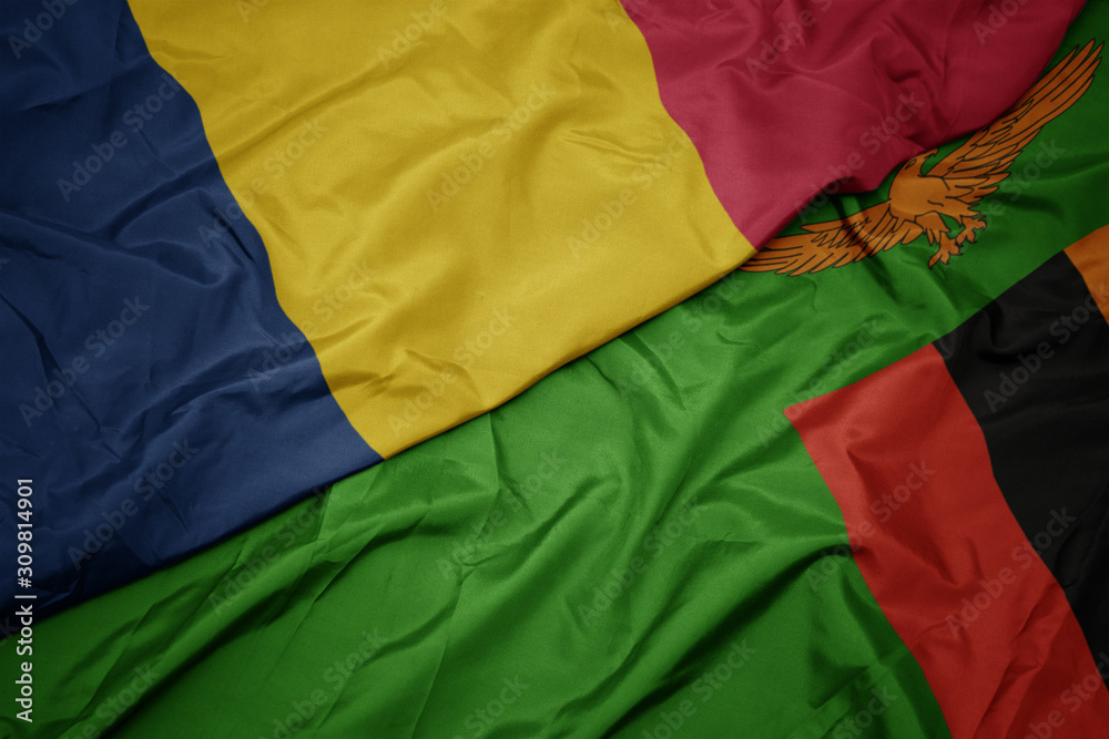 waving colorful flag of zambia and national flag of chad. waving colorful flag of zambia and national flag of chad.