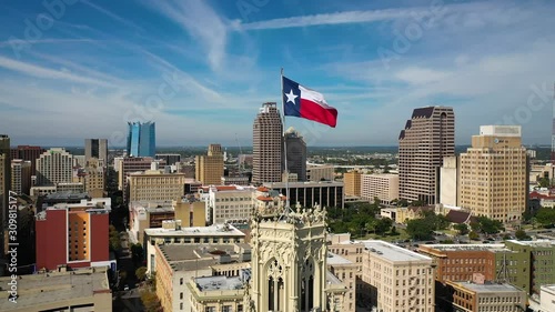 4K Texas Flag Flying Over San Antonio in Background Drone Orbit Dolly Right