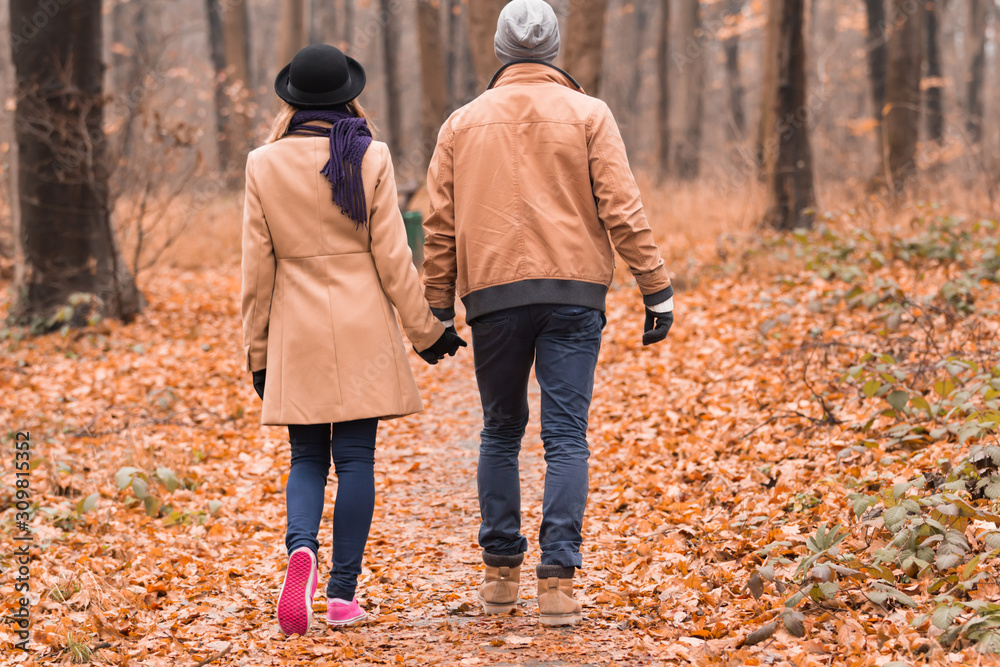 Couple in the park enjoying nice autumn / winter time. Couple in the park enjoying nice autumn / winter time.