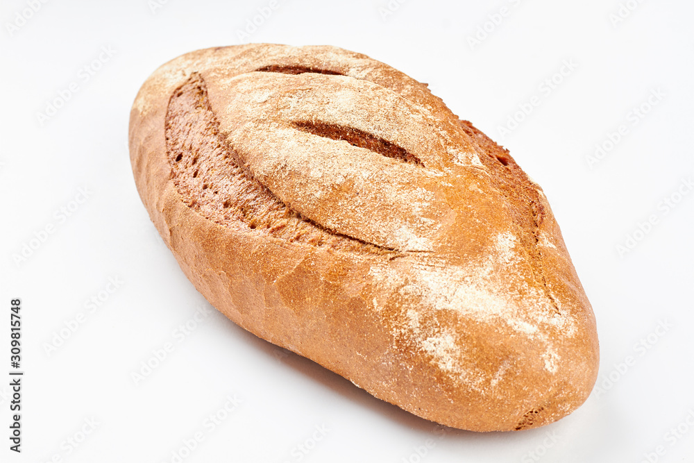 Whole loaf of a crispy bread on white background. Delicious rye bread. Homemade bread recipe. Whole loaf of a crispy bread on white background. Delicious rye bread. Homemade bread recipe.