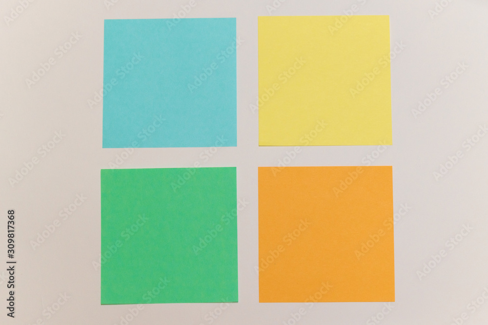 Fototapeta premium multicolored stickers. papers for records. office tools on the white backround