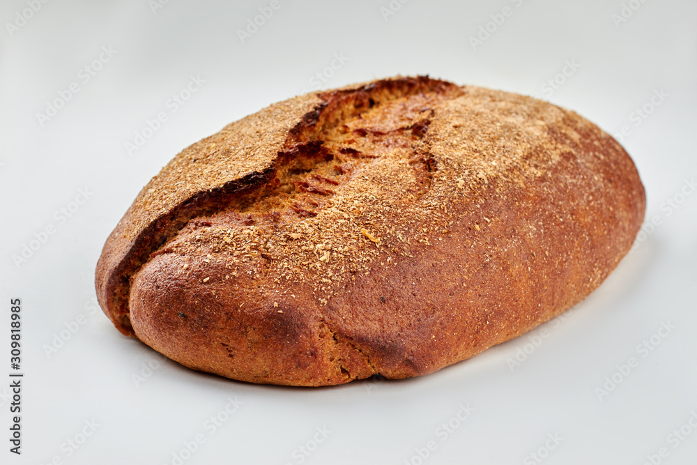 Loaf of traditional bread on white background. Loaf of rye bread. Loaf of traditional bread on white background. Loaf of rye bread.