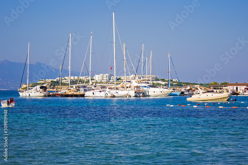 Beautiful white yachts, ships and sailing boats moored on the shores of blue Aegean sea near Akyarlar region of Bodrum, Mugla, turkey. © Blumesser