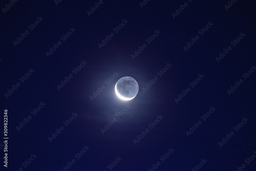 The moon among the stars and clouds The moon among the stars and clouds