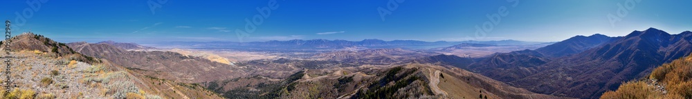 Wasatch Front Rocky Mountain landscapes from Oquirrh range looking at Utah Lake during fall. Panorama views near Provo, Timpanogos, Lone and Twin Peaks. Salt Lake City. United States.