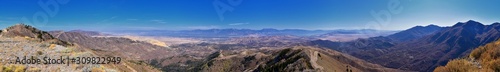 Wasatch Front Rocky Mountain landscapes from Oquirrh range looking at Utah Lake during fall. Panorama views near Provo, Timpanogos, Lone and Twin Peaks. Salt Lake City. United States.