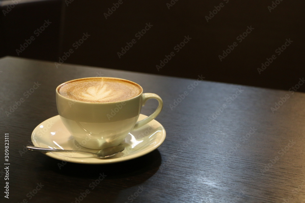 Obraz premium cup of coffee on wooden table