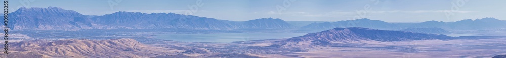 Wasatch Front Rocky Mountain landscapes from Oquirrh range looking at Utah Lake during fall. Panorama views near Provo, Timpanogos, Lone and Twin Peaks. Salt Lake City. United States. Wasatch Front Rocky Mountain landscapes from Oquirrh range looking at Utah Lake during fall. Panorama views near Provo, Timpanogos, Lone and Twin Peaks. Salt Lake City. United States.