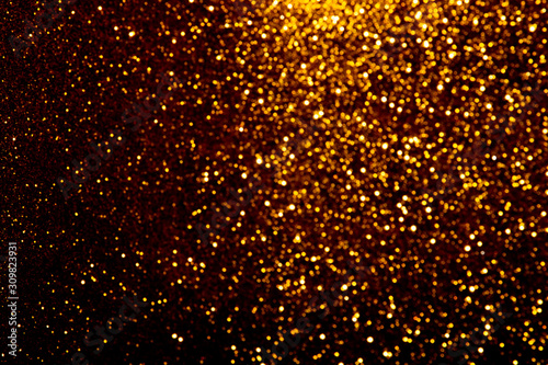 Gold blured sparkling background.