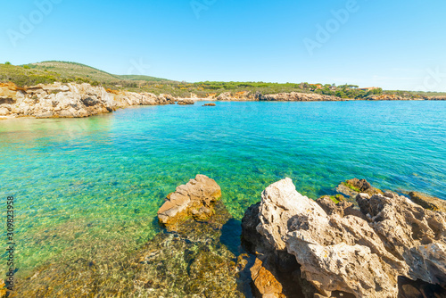 Rocks and blue sea in Alghero shore