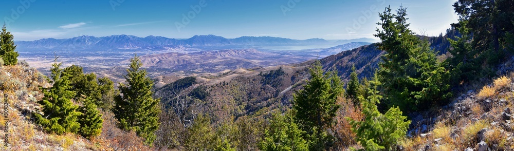 Fototapeta premium Wasatch Front Rocky Mountain landscapes from Oquirrh range looking at Utah Lake during fall. Panorama views near Provo, Timpanogos, Lone and Twin Peaks. Salt Lake City. United States.