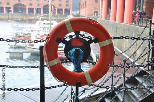 Life belt and basin on the Royal Albert Dock in Liverpool, England, Europe. The docks are a Unesco world heritage site.