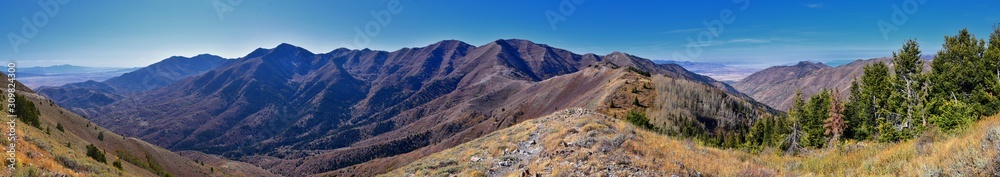 Wasatch Front Rocky Mountain landscapes from Oquirrh range looking at Utah Lake during fall. Panorama views near Provo, Timpanogos, Lone and Twin Peaks. Salt Lake City. United States.