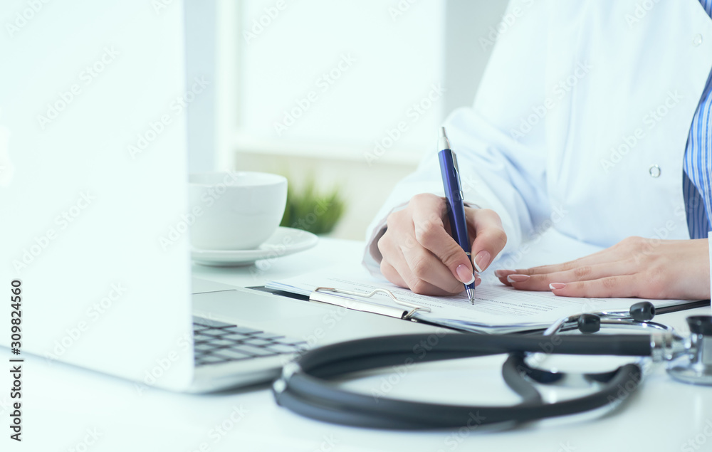 Mid section of female doctor writes prescription to patient at worktable. Panacea and life save, prescribing treatment. Mid section of female doctor writes prescription to patient at worktable. Panacea and life save, prescribing treatment.