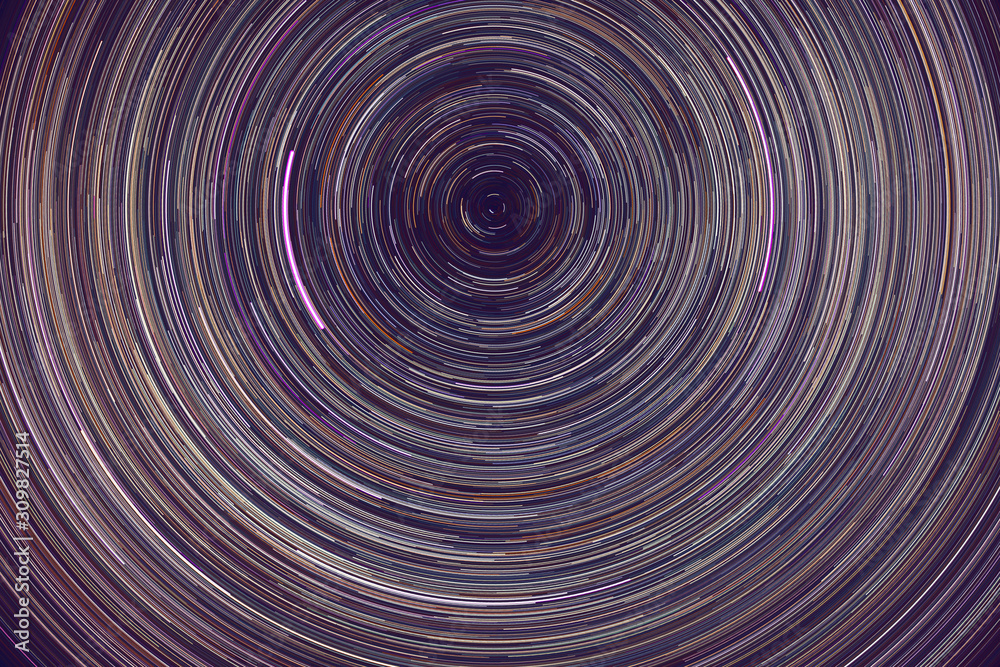 star trails - light streaks of stars around Polaris in the night sky due to Earth's rotation star trails - light streaks of stars around Polaris in the night sky due to Earth's rotation