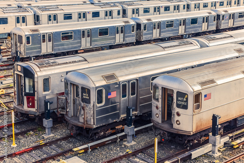 Photography Row of trains in the Maintenance Shop at sunset
