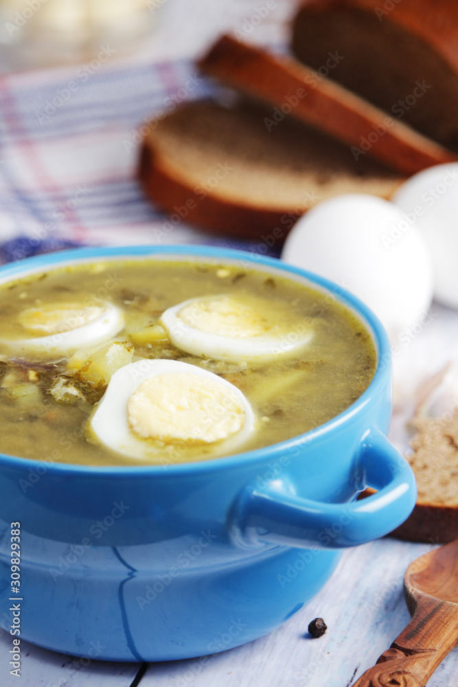 A bowl with homemade sorrel soup A bowl with homemade sorrel soup