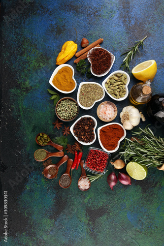 Fototapeta Naklejka Na Ścianę i Meble -  Spices and herbs on table. Food and cuisine ingredients with oil and vinegar
