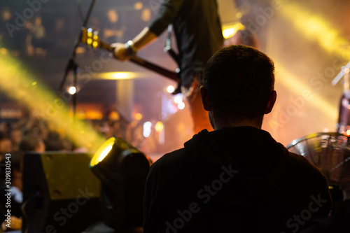 The silhouette of spectator near the stage.