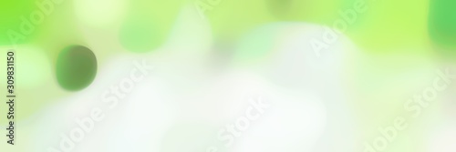 unfocused bokeh horizontal background graphic with beige  pastel green and pale green colors space for text or image
