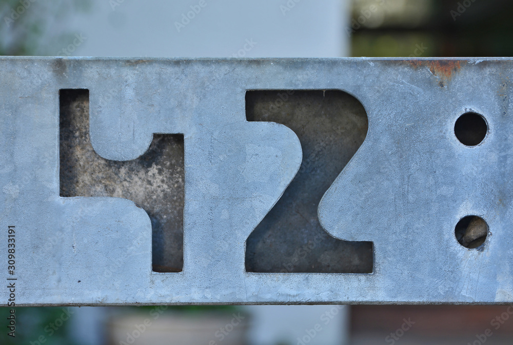 A house number plaque, showing the number fourty two (42) A house number plaque, showing the number fourty two (42)
