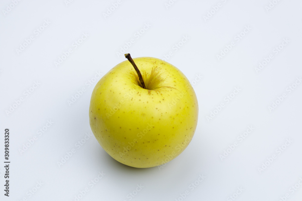 close view golden juicy apple on white background