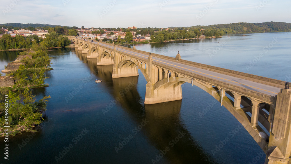 Arched bridge across river, classic architecture, aerial view
