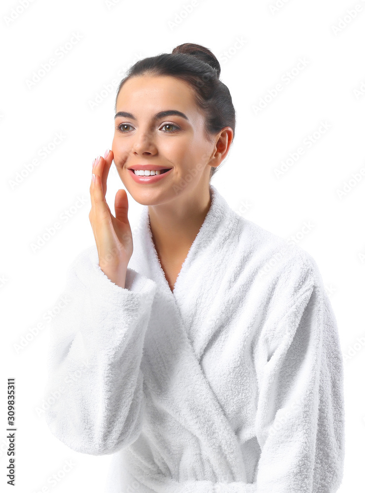 Beautiful young woman in bathrobe on white background Beautiful young woman in bathrobe on white background