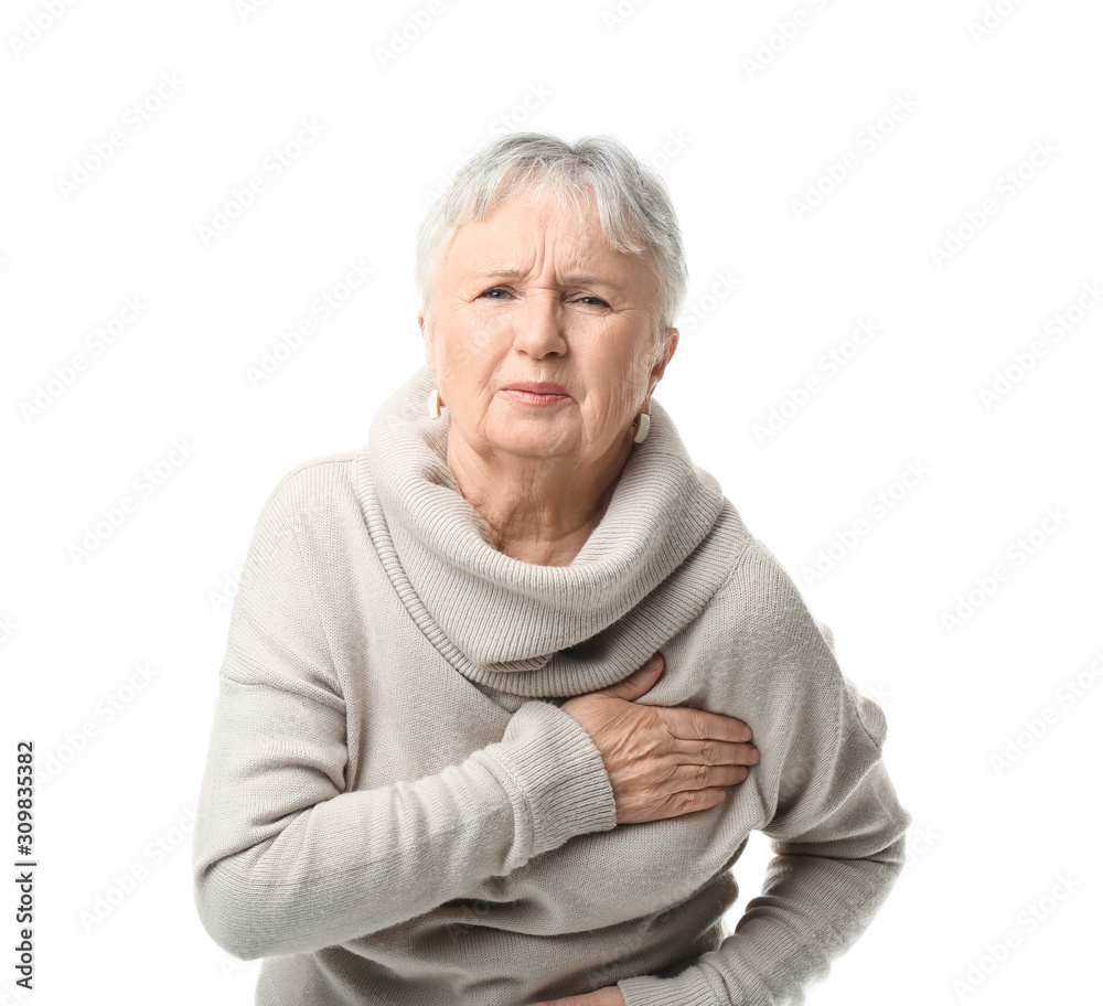 Senior woman suffering from heart attack on white background Senior woman suffering from heart attack on white background