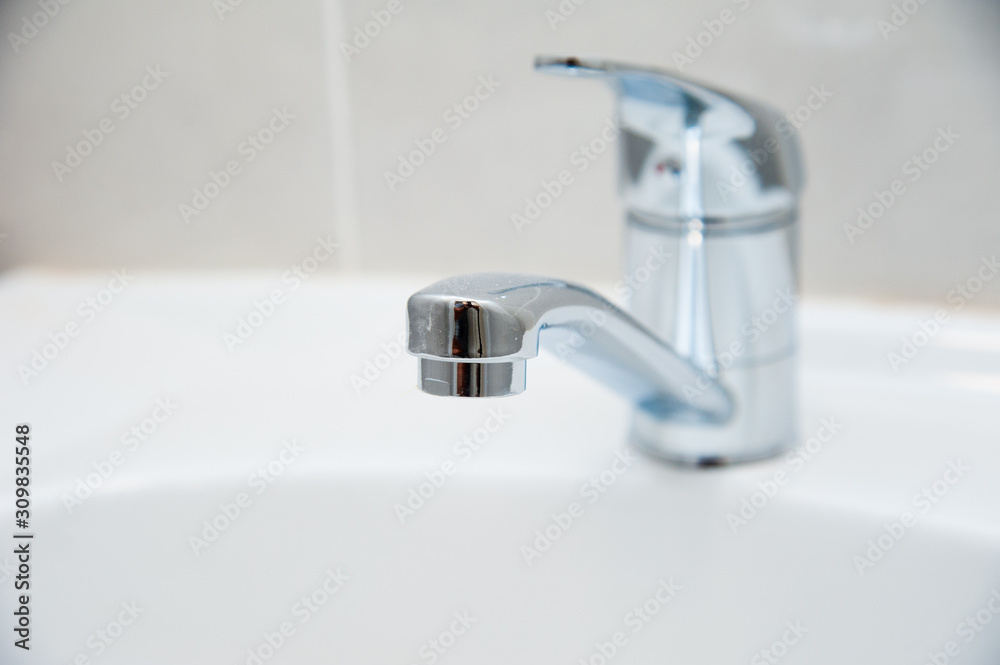 Close-up of row modern ceramic wash hand basins Close-up of row modern ceramic wash hand basins
