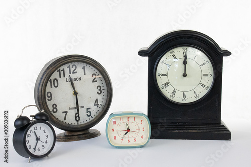 Multiple clocks isolated on a white background