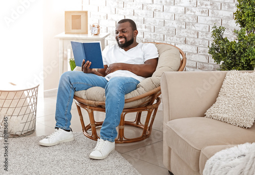 African-American man readin...