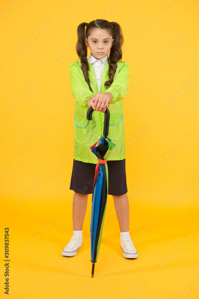 accessory for fall season. autumn kid fashion. dry and comfortable in rainy weather. small girl in raincoat with umbrella. schoolgirl waterproof raincoat. feel protected and happy accessory for fall season. autumn kid fashion. dry and comfortable in rainy weather. small girl in raincoat with umbrella. schoolgirl waterproof raincoat. feel protected and happy