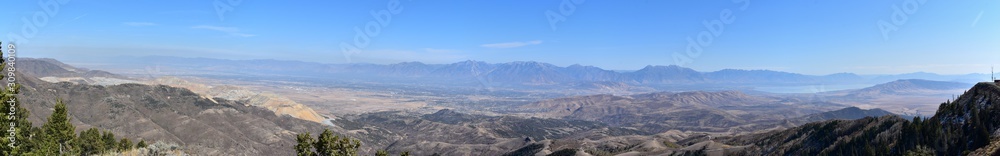 Rocky Mountain Wasatch Front peaks, panorama landscape view from Butterfield canyon Oquirrh range by Rio Tinto Bingham Copper Mine, Great Salt Lake Valley in fall. Utah, United States.