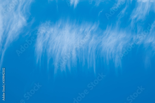 High white clouds in bright blue sky © Volodymyr Chaban