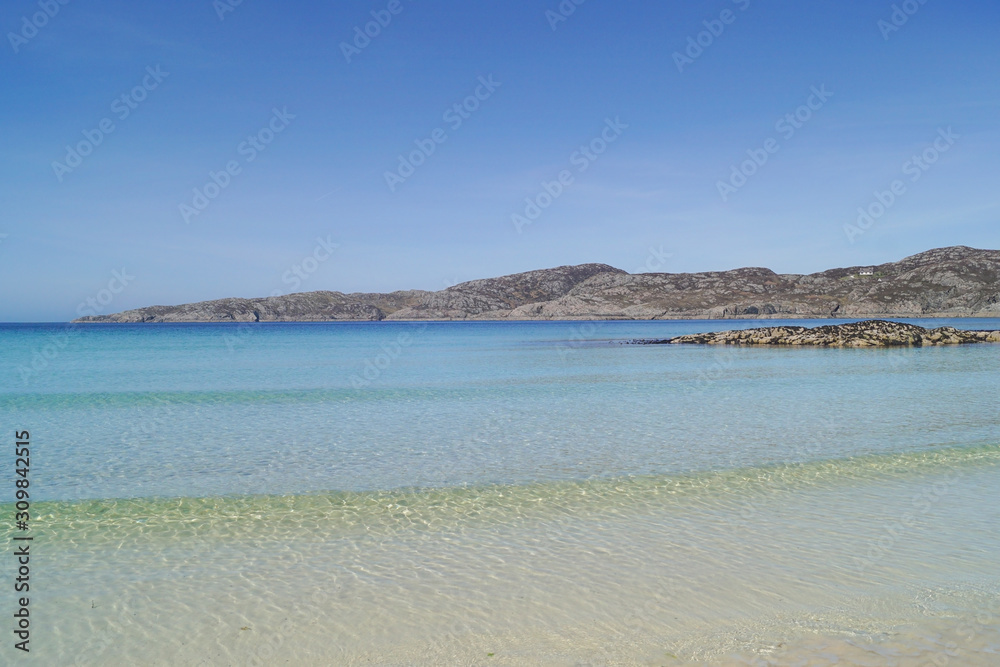 The bay next to Achmelvich beach on a sunny day in the Scottish highlands