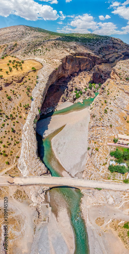 Aerial view of the Severan Bridge, Cendere Koprusu is a late Roman bridge, close to Nemrut Dagi and Adiyaman, Turkey. Roadway flanked by ancient columns of Roman Emperor Lucius Septimius Severus photo