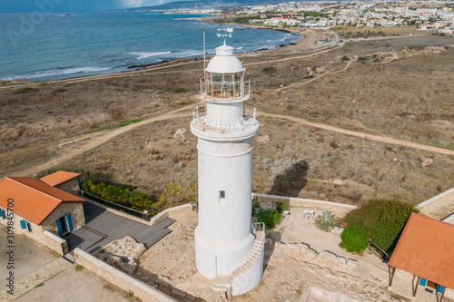 Paphos Lighthouse, Cyprus, aerial view from drone. Located in Paphos archeological park on mediterranean seaside or coast, built in 1888. photo