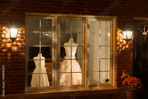Dress shop window at night in historic Kleinberg Ontario photo