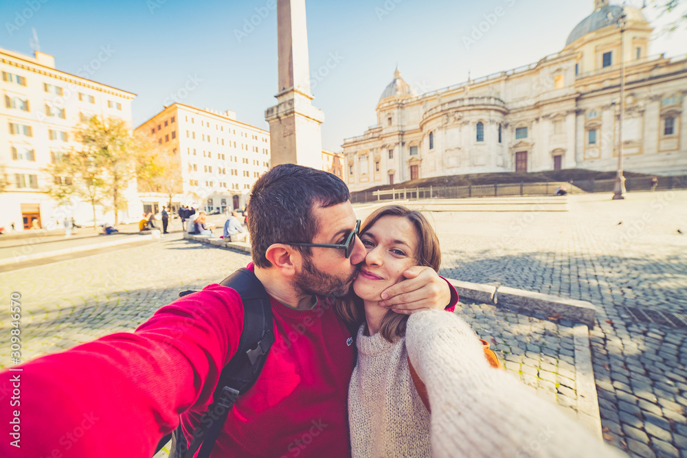 Fototapeta premium happy handsome tourist couple taking selfie in Rome, capital of Italy