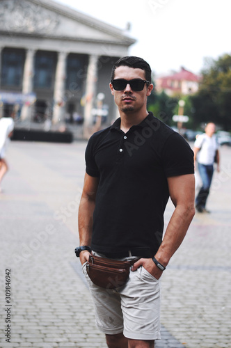  Guy in black polo and sunglasses.Business portrait.